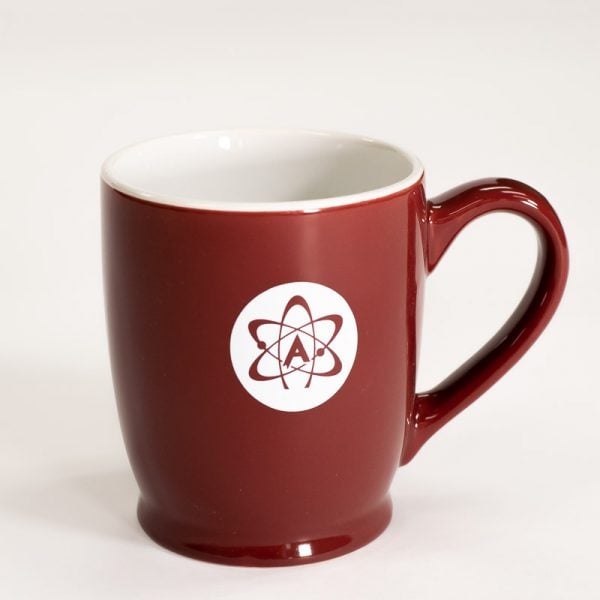 Red glazed mug with American Atheists logo in white on front.